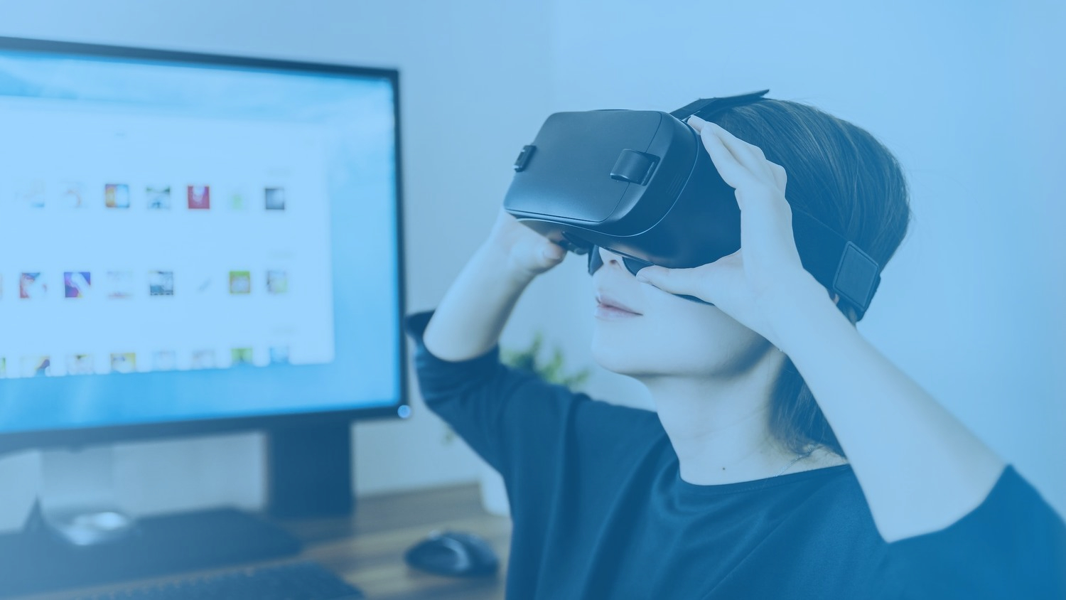 Background image of a woman playing with a virtual reality oculus.